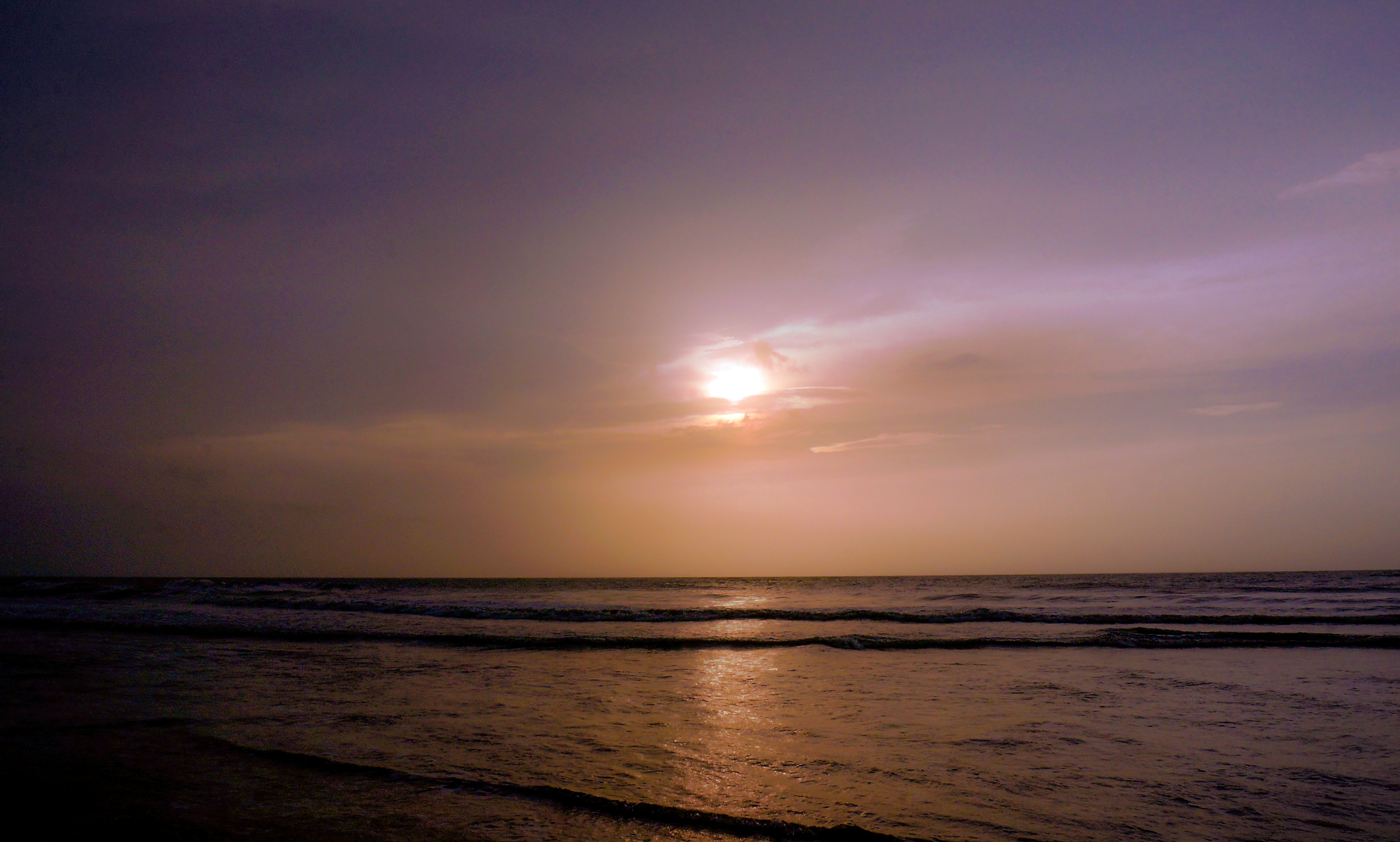 body of water during sunset